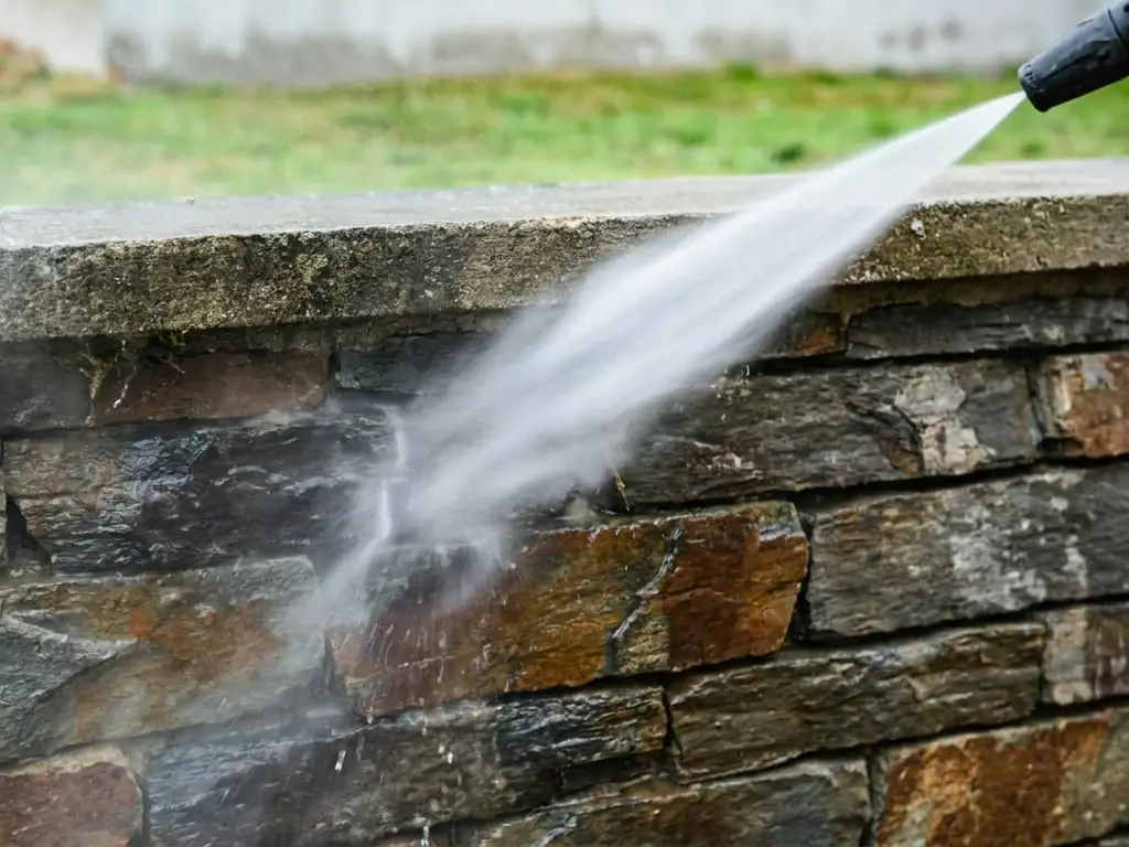 Stone wall pressure washing in Cherry Hill, NJ — removing algae, staining, and weathering from exterior masonry, brick, and natural stone surfaces.