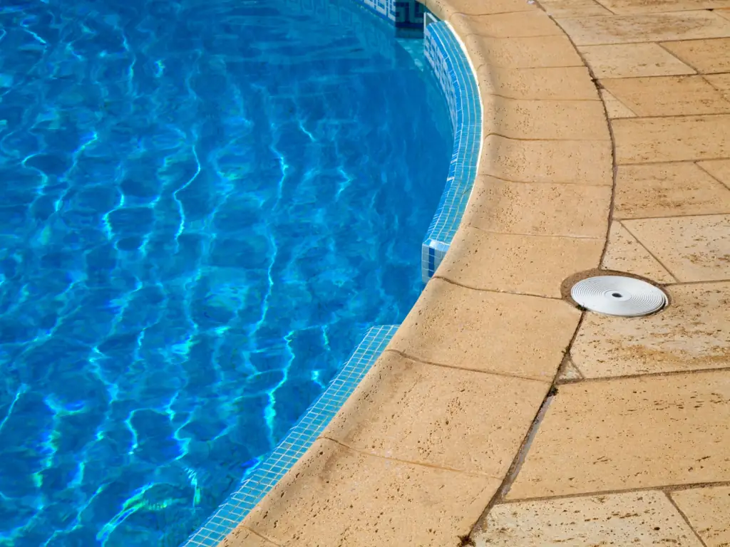 Clean poolside walkway after pressure washing in Swedesboro, NJ — removing algae and slip hazards from pool deck and surrounding concrete surfaces.